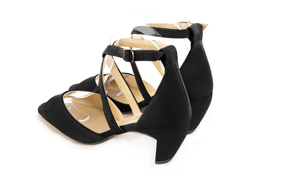 Women's matt black elegant sandals closed at the back with crossed straps. Square toe. Medium comma heels - Rear view